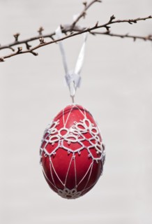 Hand-painted egg shell hanging from a branch to celebrate Easter at the Old Vienna Easter Market at the Freyung.
