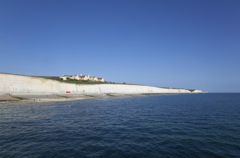 White cliff coastline with Roedean private school for girls.