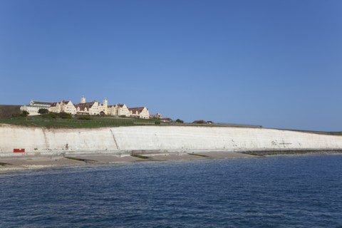 White cliff coastline with Roedean private school for girls.