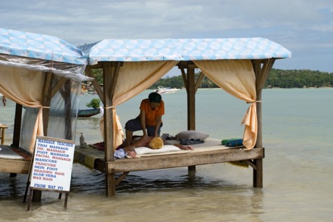 Thailand, Koh Samui , Chaweng Beach, Beach Massage on a four poster bench over the sea with a woman