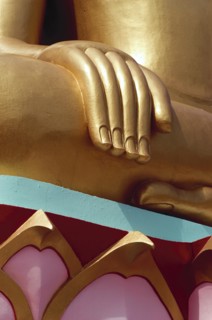 Thailand, Koh Samui, Large golden seated Buddha with detail of hand and colourful base. Photo :