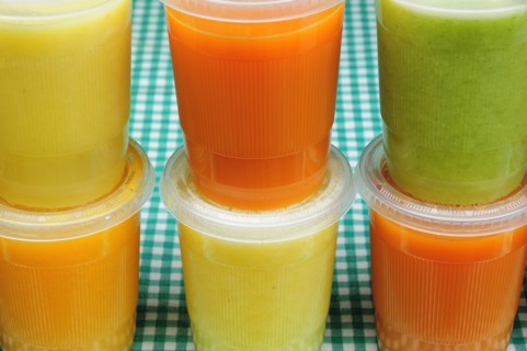 Mexico, Bajio, Guanajauto, Yellow green and orange jugos or fruit juices. Photo : Nick Bonetti