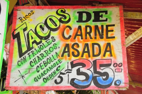 Mexico, Bajio, Zacatecas, Sign for taco food stall with highlighted text and price. Photo : Nick