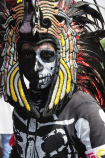 Mexico, Federal District, Mexico City, Portrait of Michacoa Aztec dancer in feather head-dress and