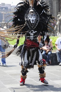 Mexico, Federal District, Mexico City, Michicoa Aztec dancer dressed in costume of Senor de Muerte