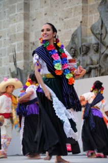 Mexico, Jalisco, Guadalajara, Plaza Tapatia Woman folk dancer from Guerrero State performing in