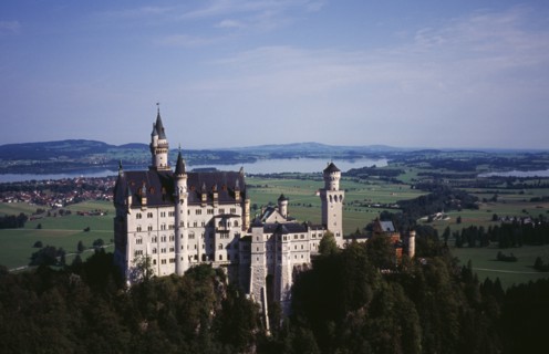 Germany, Bayern, Allgau, Fussen. Schloss Neuschwanstein Castle with Forggensee Lake in the