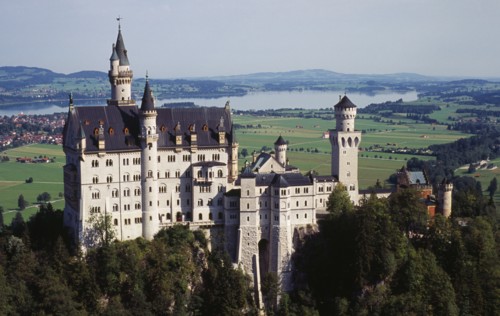 Germany, Bayern, Allgau, Fussen. Schloss Neuschwanstein Castle with Forggensee Lake in the