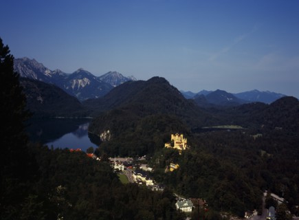 Germany, Bayern, Schwangau, View looking down on town overlooked by Schloss Hohenschwangau and