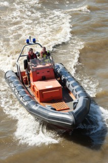 England, London, City Airport fire and rescue boat on the river Thames near Tower bridge. Photo :