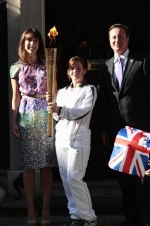 England, London, Olympic Torch relay in Downing Street Samantha and Prime Minister David Cameron