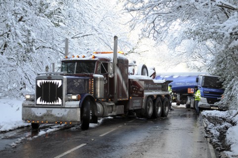 Weather, Winter, Snow, Recovery truck extracting a Jack-knifed fuel tanker on icy A22 main road