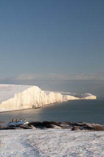 England, East Sussex, Seven Sisters, Snow covered coastline from Birling gap showing the Coastguard