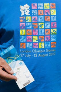 England, London, An Olympic spectator wearing an official T-shirt holding their official ticket for