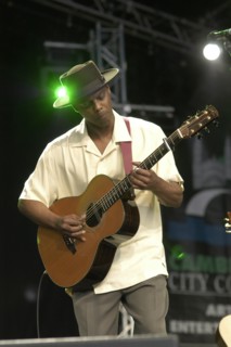 England, Cambridgeshire, Cambridge, Folk Festival Eric Bibb performing on stage with acoustic