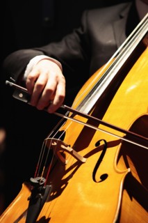 Music, Instruments, Strings, Cello detail of hand using bow across the strings. Photo : Sean Aidan