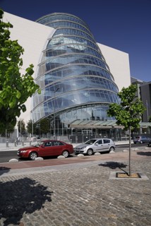 Ireland, County Dublin, Dublin City, Convention Centre building view of the facade with tree in