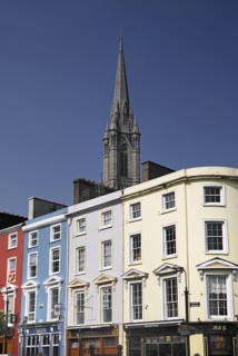 Ireland, County Cork, Cobh, St Colmans Cathedral overlooking colourful houses. Photo : Hugh Rooney