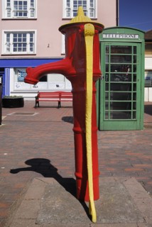 Ireland, County Cork, Kinsale, Colourful old water pump and telephone box. Photo : Hugh Rooney