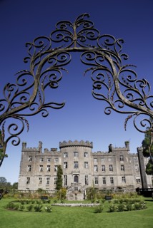 Ireland, County Sligo, Markree, Castle hotel castle and garden viewed through ornamental iron