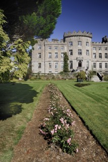Ireland, County Sligo, Markree, Castle hotel view of a section of the castle with row of flowers in