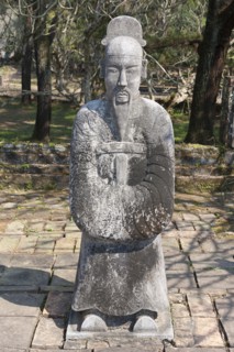 Vietnam, Hue, A stone statue of a man at the tomb of Emperor Tu Duc. Photo : Mel Longhurst