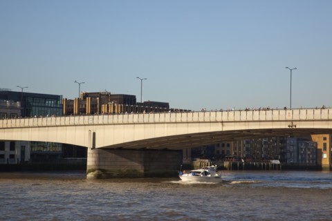 England, London, Southwark southbank early morning commuters crossing London Bridge to get to the