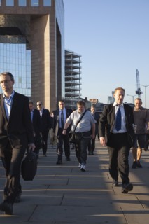 England, London, Early morning commuters crossing London Bridge towards the City Financial district