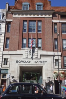 England, London, Borough Market entrance with black taxi cab in traffic. Photo : Stephen Rafferty