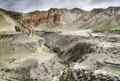 Nepal, Upper Mustang, Ghemi, Colorful layered mountains and eroded plateau along the route from