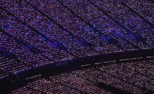 England, London, Stratford Olympic games closing ceremony LED paddles visible in the darkness.