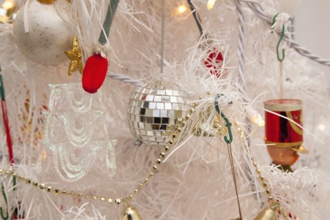 Festivals, Religious, Christmas, Detail of tree decorated with lights tinsel and various baubles.