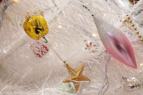 Festivals, Religious, Christmas, Detail of tree decorated with lights tinsel and various baubles.