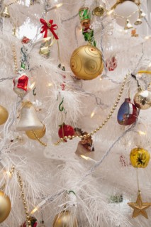 Festivals, Religious, Christmas, Detail of tree decorated with lights tinsel and various baubles.