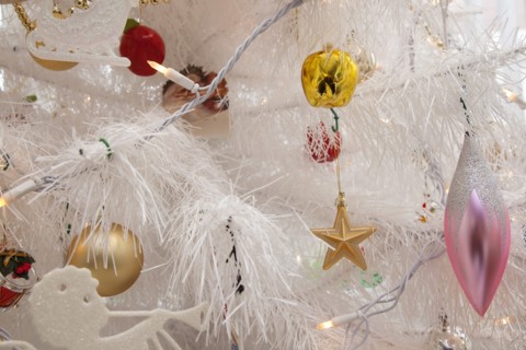 Festivals, Religious, Christmas, Detail of tree decorated with lights tinsel and various baubles.