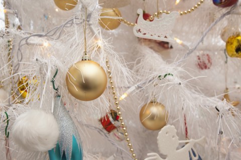 Festivals, Religious, Christmas, Detail of tree decorated with lights tinsel and various baubles.