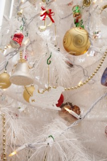 Festivals, Religious, Christmas, Detail of tree decorated with lights tinsel and various baubles.