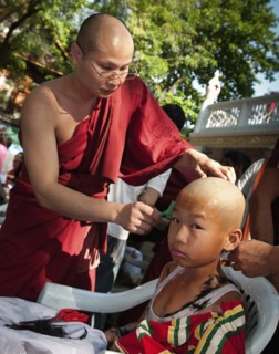 Thailand, Chiang Mai, Shaving of hair is part of the ritual of Poi Sang Long. This is the