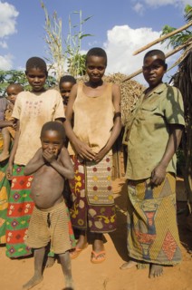Burundi, Cibitoke Province, Kirundo, A family beside the road living in poverty child with obvious