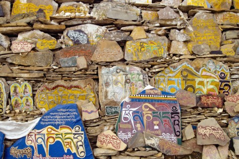 China, Szechuan Province, Tibet, Litang county Mani stone wall outside Litang Buddhist Monastery in