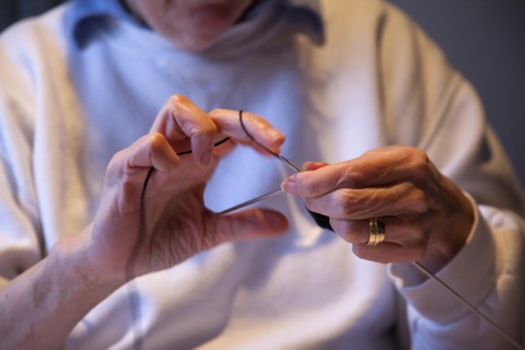 Crafts, Textiles, Knitting, Woman hand knitting wool together with needles. 
Photo Stephen