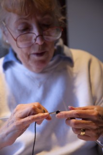 Crafts, Textiles, Knitting, Woman hand knitting wool together with needles. 
Photo Stephen