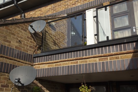 England, West Sussex, Bognor Regis, Satelite dishes on exterior of flats. 
Photo Stephen Rafferty