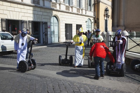 Italy, Lazio, Rome, Tourists dressed as Bishops to take tour on Segways. 
Photo Stephen Rafferty /