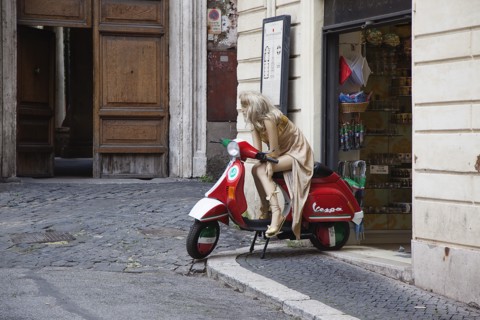 Italy, Lazio, Rome, Mannequin seated on Vespa outside tourist shop. 
Photo Stephen Rafferty / Eye