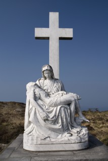 Ireland, County Cork, Sheeps Head Peninsula, Religious staue showing a Calvary scene. 
Photo Hugh