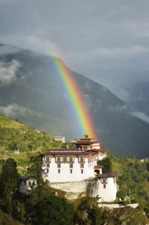 Bhutan, Lhuentse Dzong, Bhutan  Lhuentse Dzong with colourful rainbow overhead.