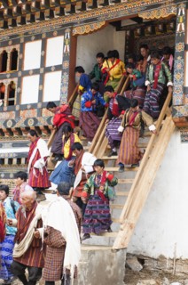 Bhutan, Gangtey Gompa, Tsecchu festival crowds descending temple steps dressed in their best