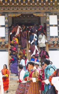 Bhutan, Gangtey Gompa, Tsecchu festival crowds descending temple steps dressed in their best
