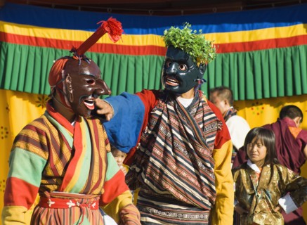 Bhutan, Thimpu Dzong, Two Atsaras, or comedians at a masked dance Tsecchu. 
Photo Nic I'Anson